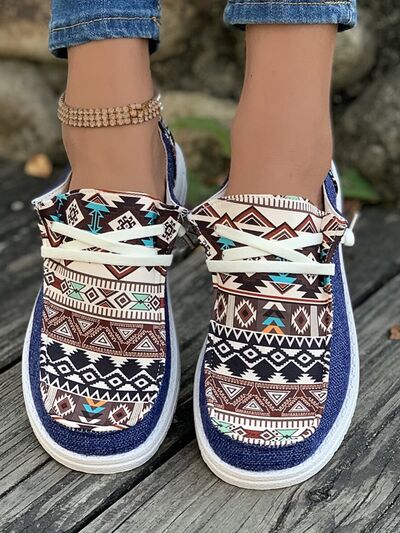 Geometric lace-up round toe slip-ons with tribal patterns and canvas material.
