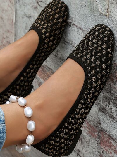 Mesh round toe flat slip-ons in black and beige pattern, featuring rubber and mesh material.