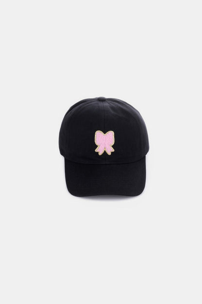 Zenana Ribbon Bow Chenille Patch Baseball Cap in black with pink bow embellishment.