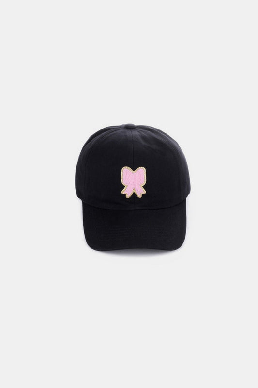 Zenana Ribbon Bow Chenille Patch Baseball Cap in black with pink bow embellishment.