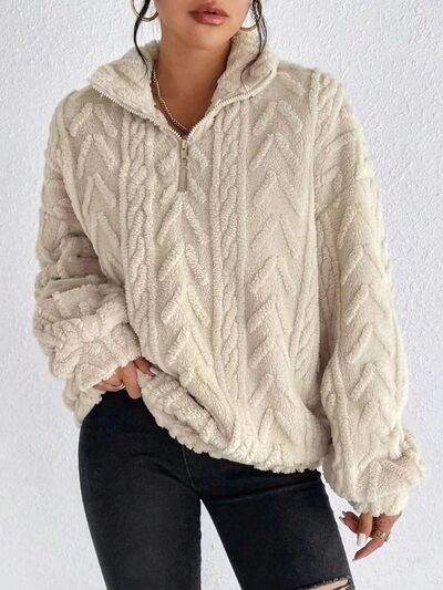Fuzzy quarter zip long sleeve sweatshirt, 100% polyester, basic style, machine washable.
