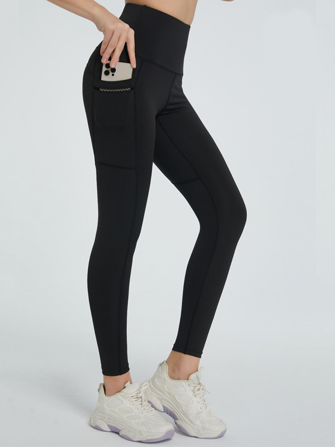 High waist active leggings with phone pocket, moderate stretch fabric.