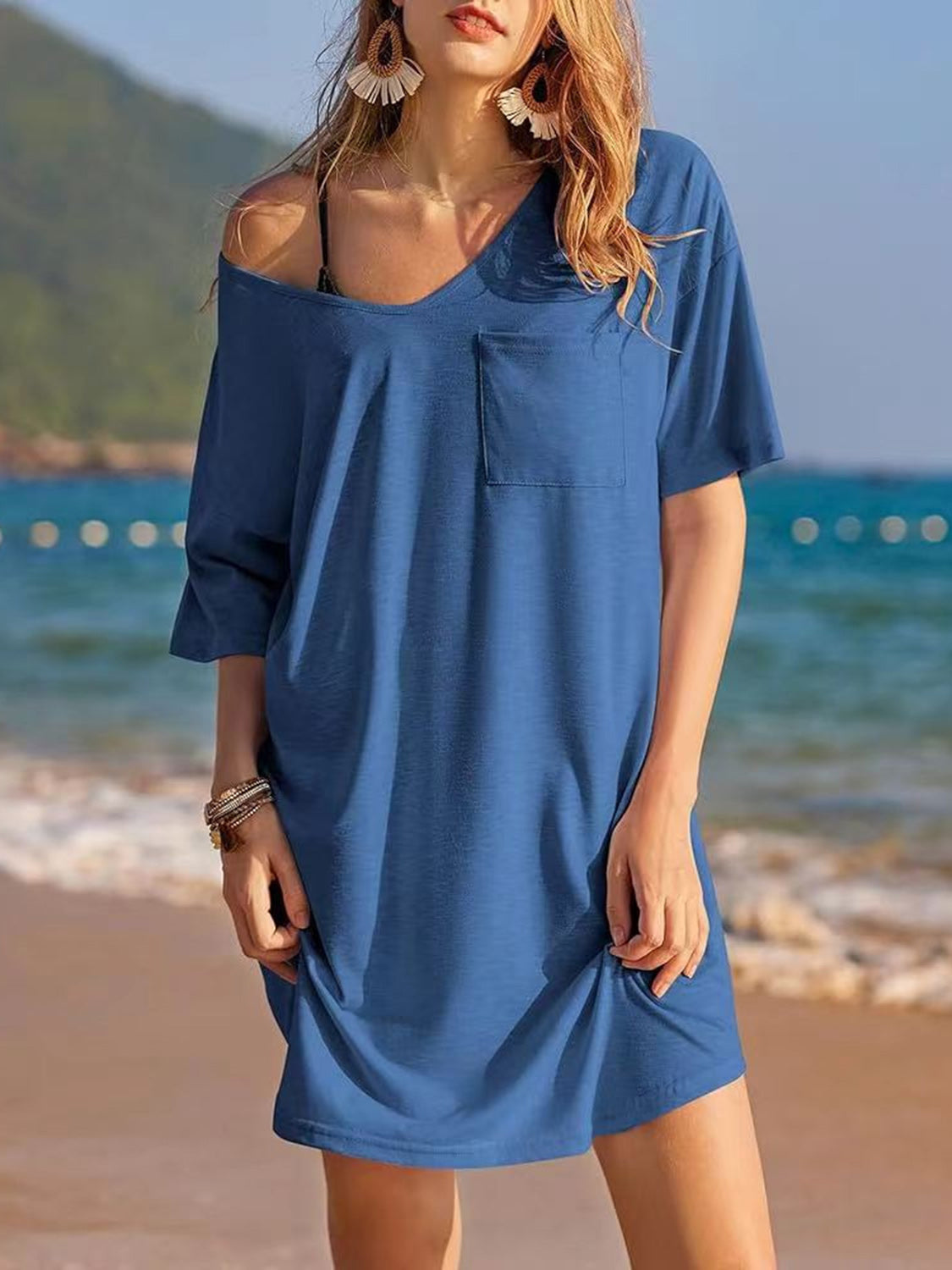 Pocketed V-Neck short sleeve tee dress in blue, slightly stretchy cotton fabric, worn by the beach.