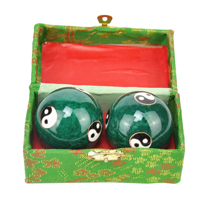Yin Yang Baoding relaxation balls in a decorative box for stress relief and balance.