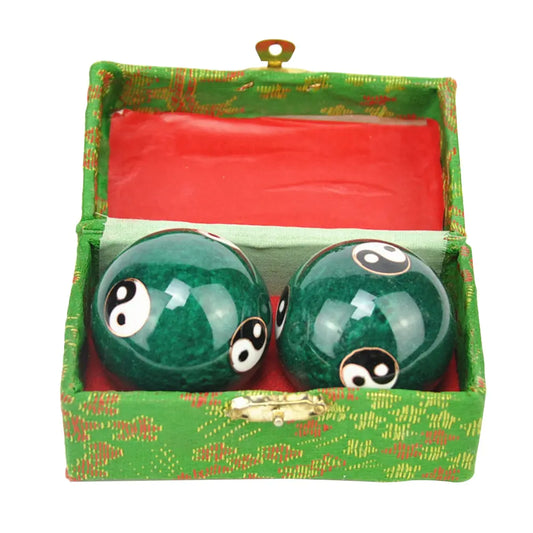 Yin Yang Baoding relaxation balls in a decorative box for stress relief and balance.