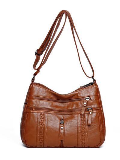 Medium-sized PU leather shoulder bag with adjustable strap.