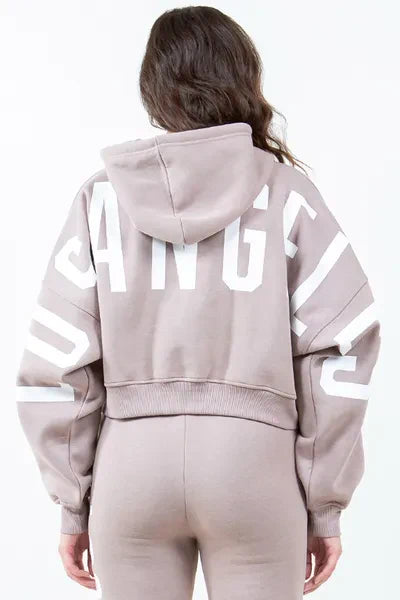 American Bazi letter graphic long sleeve drawstring cropped hoodie with urban vibe.