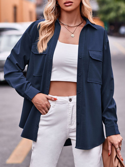 Pocketed button-up dropped shoulder shacket in navy with two front pockets and single-breasted design.