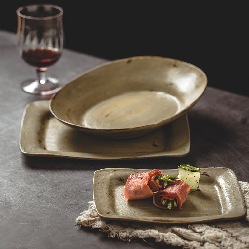 Square ceramic vintage plates with intricate designs, showcasing food; perfect for elegant dining settings.