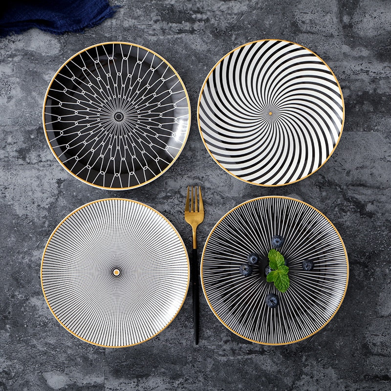 Geometric pattern ceramic plates with intricate designs on a dark background.