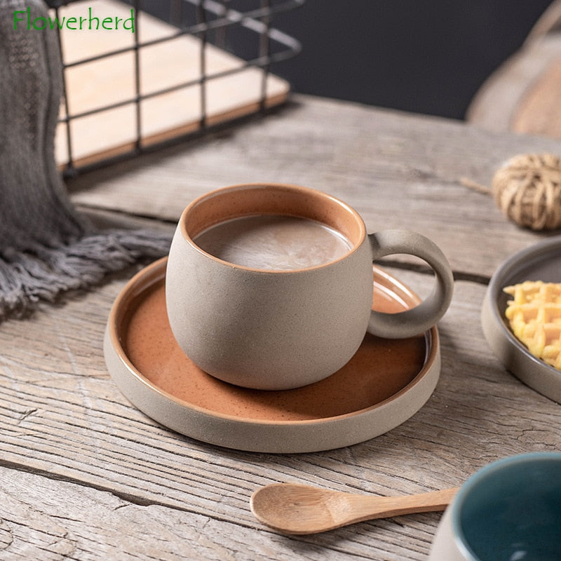 Ceramic Coffee Mug with stylish design on wooden table, includes saucer and spoon.