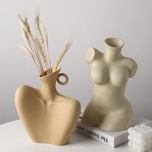 Home décor sculpture ceramic vases in beige, featuring unique shapes for artistic decoration.