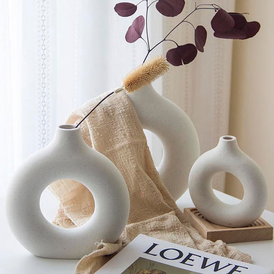 Aesthetic Nordic Vase in cream color, modern ceramic design, styled with florals on a tabletop.