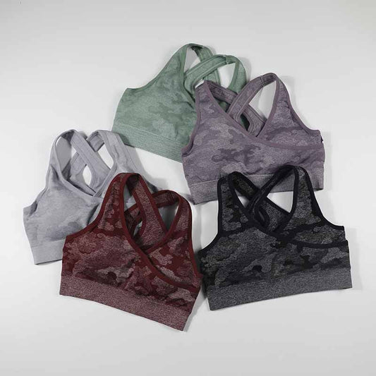 Women camo seamless sport yoga bras in various colors with cross back design.