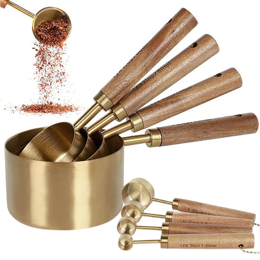 Gold stainless steel measuring cups and spoon set with wood accents for kitchen elegance and functionality.