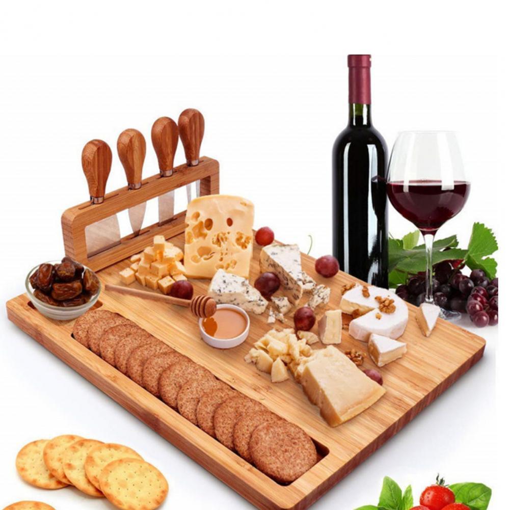 Bamboo Aperitif Tagliere with appetizers, cheese, crackers, and wine.